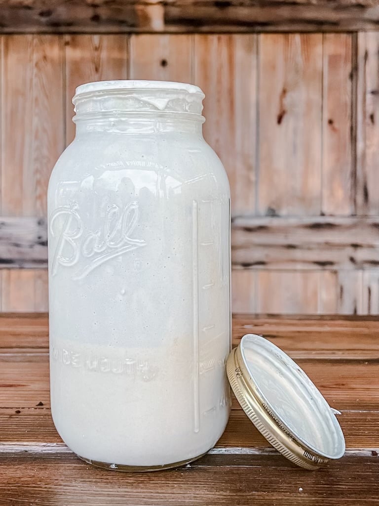Ball canning jar with sourdough starter inside.